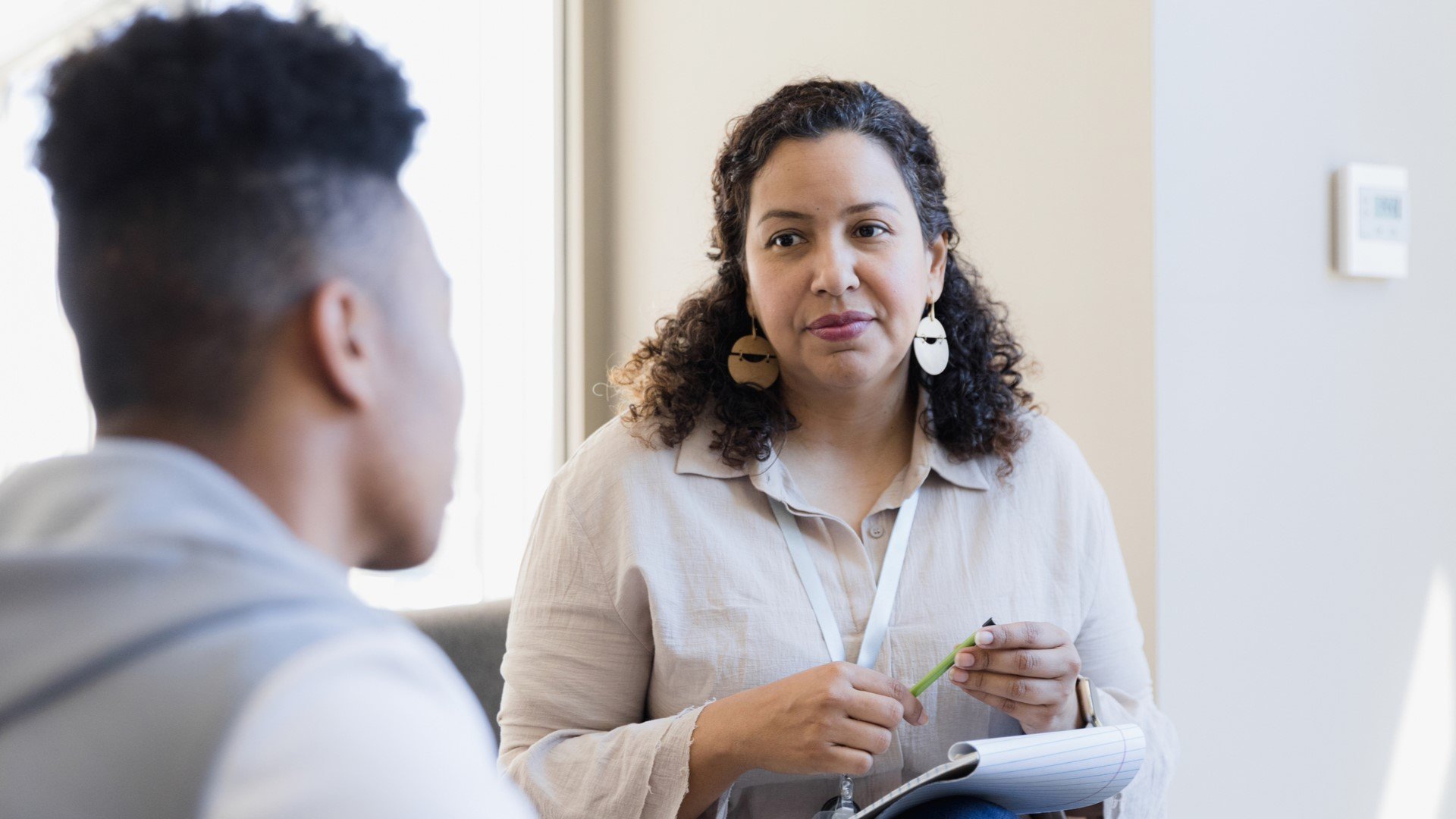 student talking to faculty member