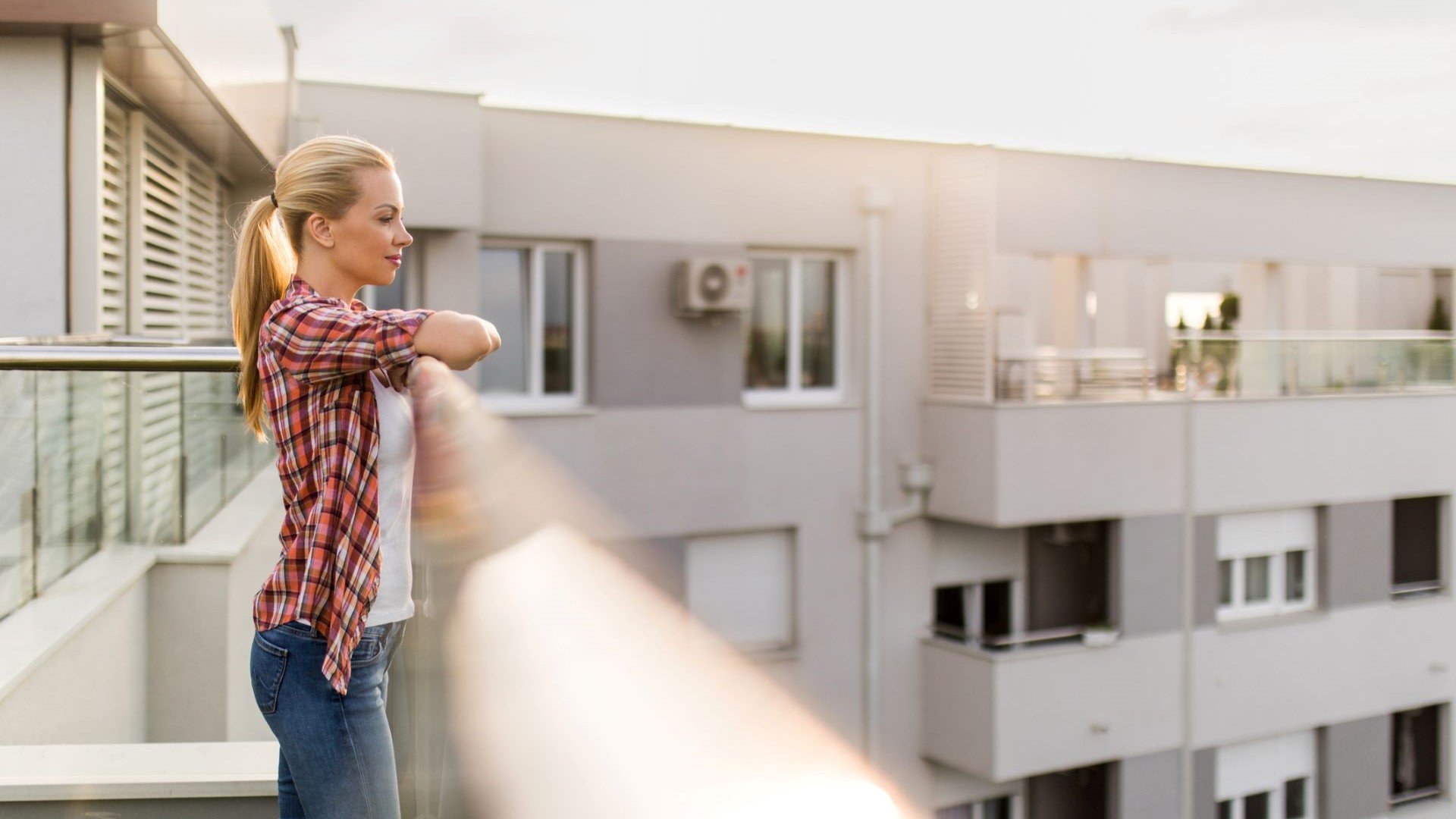 student standing on balcony
