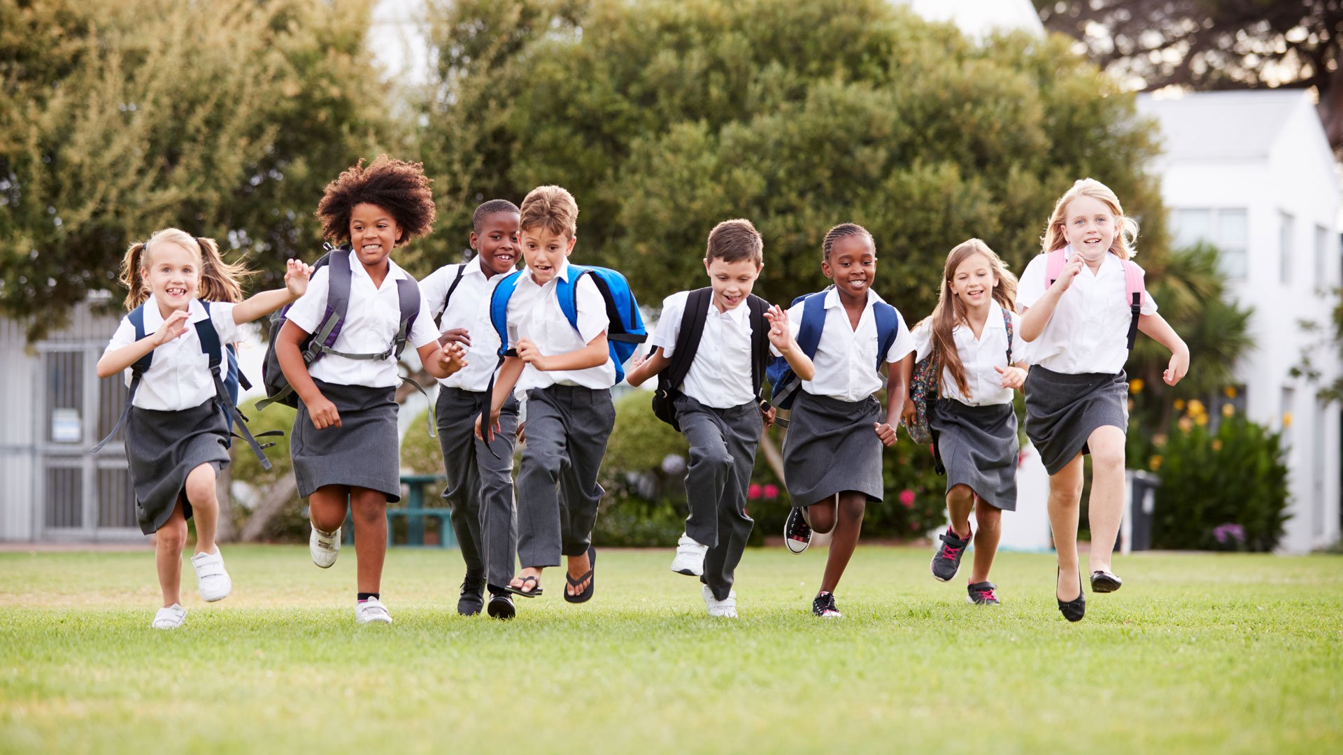 Group of running students in uniform