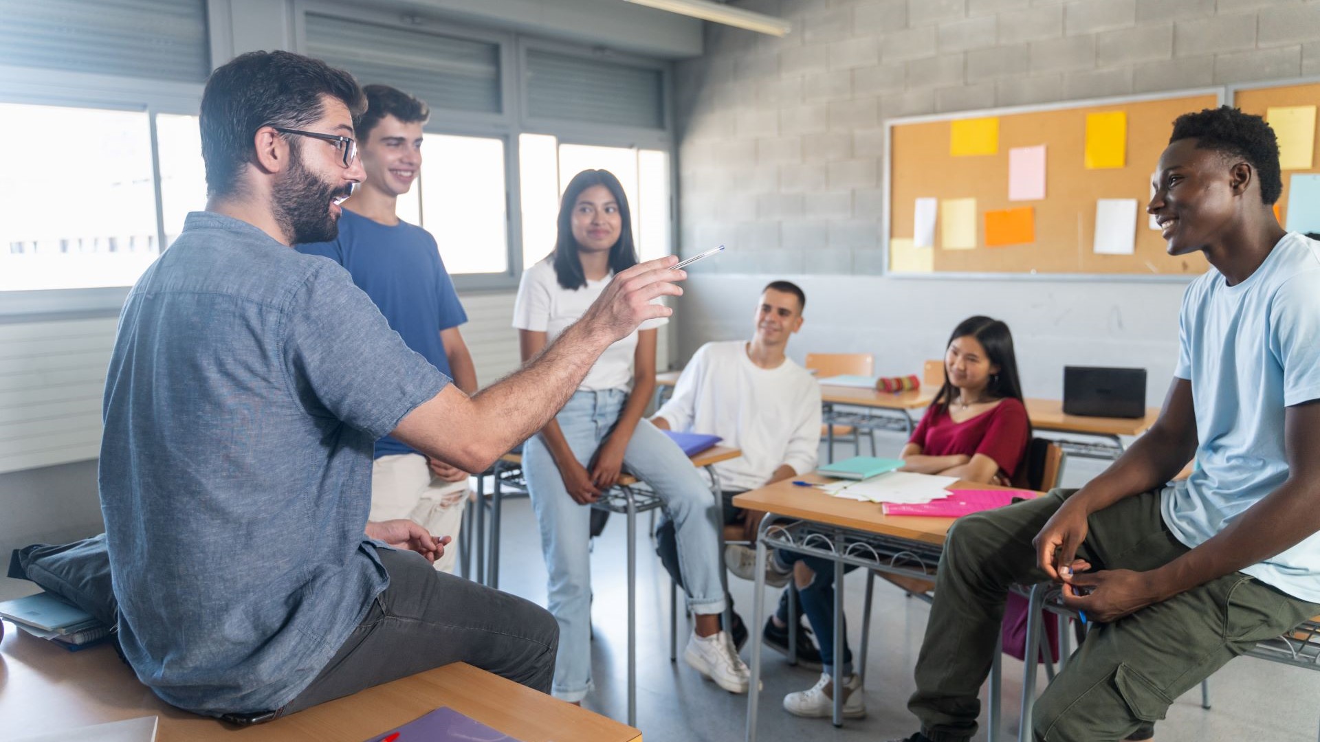 high school teacher and students in classroom