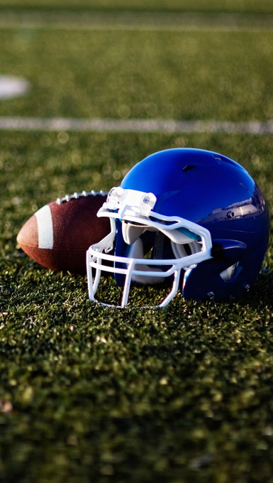 close up of football helmet on field