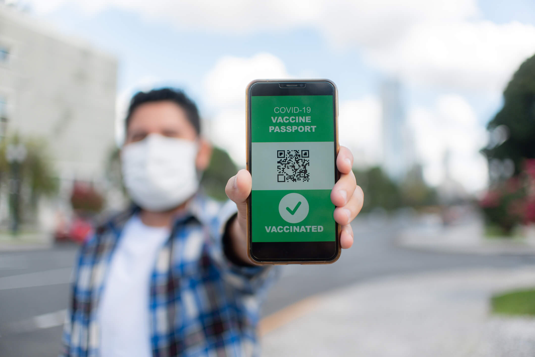 student showing vaccination card