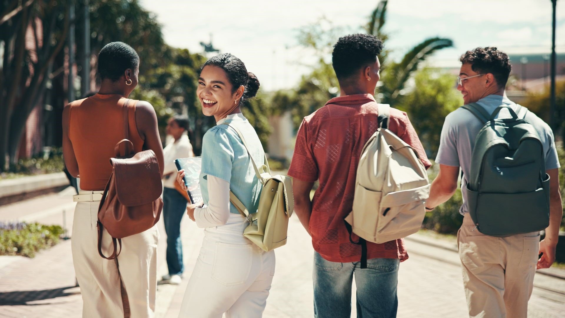 college students walking across campus