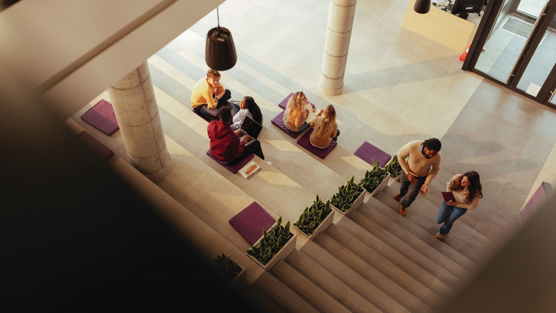 university students in building lobby